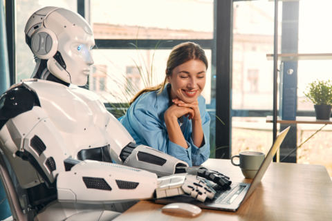 robot-and-woman-working-on-laptop-in-office-2026-01-09-07-24-48-utc